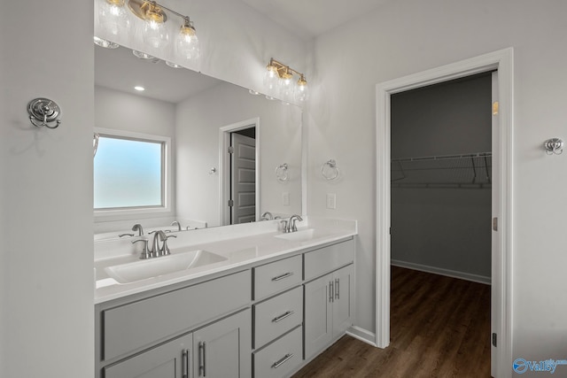 bathroom featuring hardwood / wood-style flooring and vanity