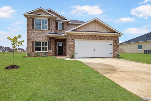 craftsman-style home featuring a garage, a front yard, and central air condition unit