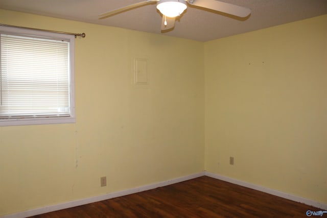 unfurnished room with baseboards, a ceiling fan, and wood finished floors