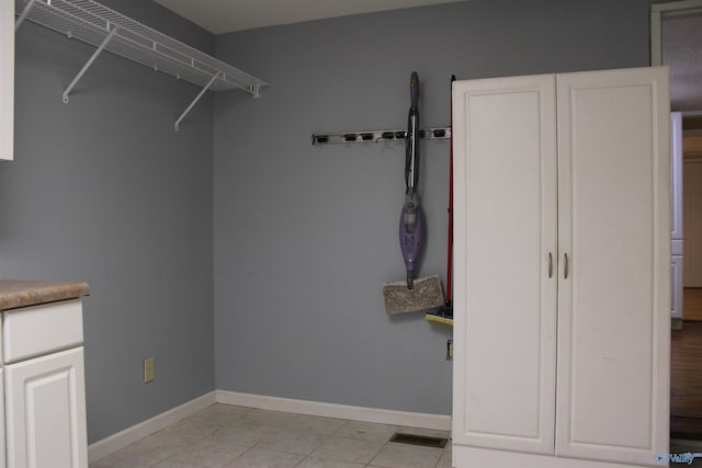 walk in closet with visible vents and light tile patterned floors