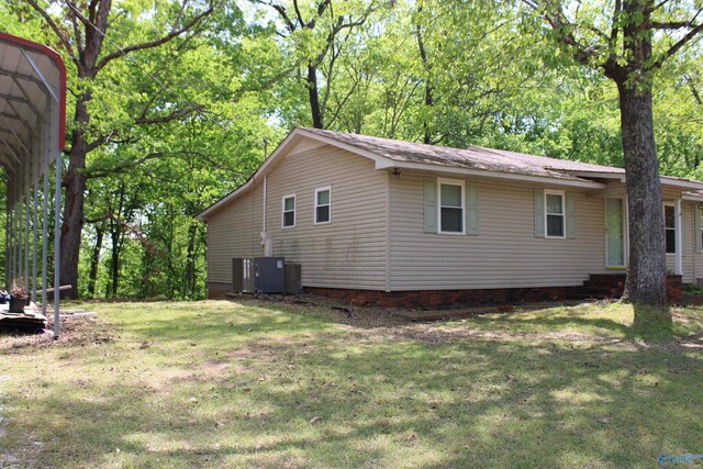 view of property exterior with a lawn