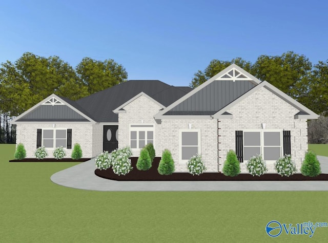 FLAGSTAFFB1 Mallard Dr, Madison, AL 35756 - view of front of home with board and batten siding, brick siding, and a front lawn