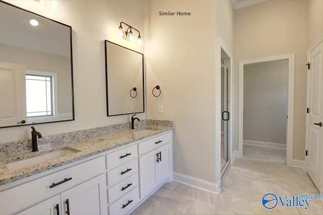 FLAGSTAFFB1 Mallard Dr, Madison, AL 35756 - full bathroom featuring double vanity, baseboards, and a stall shower