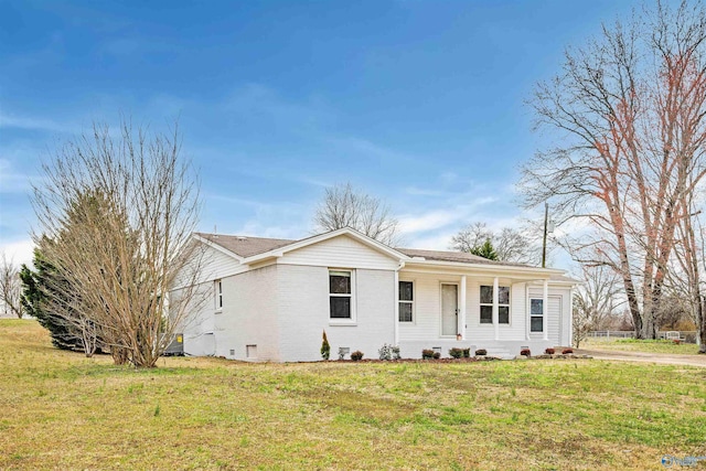 ranch-style home featuring crawl space, a front yard, and brick siding