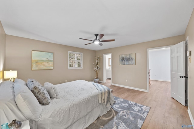 bedroom featuring baseboards, a ceiling fan, and light wood-type flooring