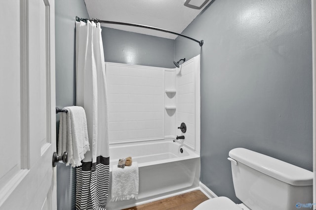 bathroom with toilet and shower / tub combo with curtain