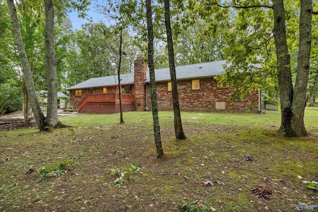 view of yard with a wooden deck