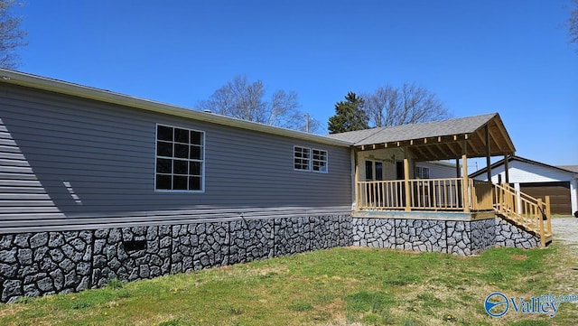 7739 Allison Loop, Athens, AL 35611 - back of property with a garage and a lawn