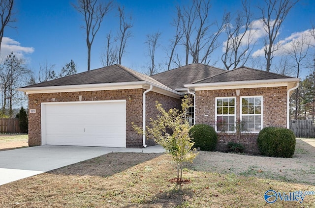 ranch-style home with a garage and a front yard