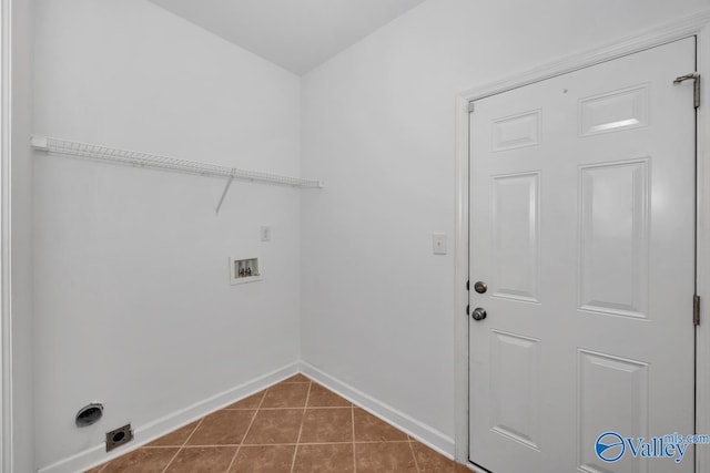 laundry room with hookup for an electric dryer, hookup for a washing machine, and tile patterned floors