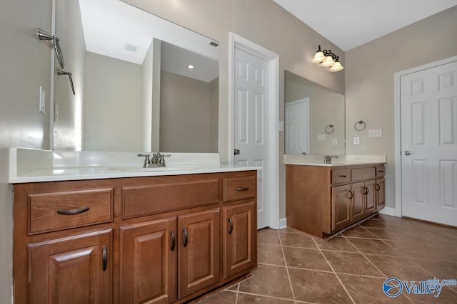 bathroom with tile patterned floors and vanity