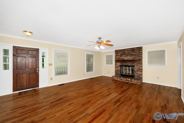 156 San Leonardo Way, Huntsville, AL 35811 - unfurnished living room featuring wood finished floors, ceiling fan, crown molding, baseboards, and a fireplace