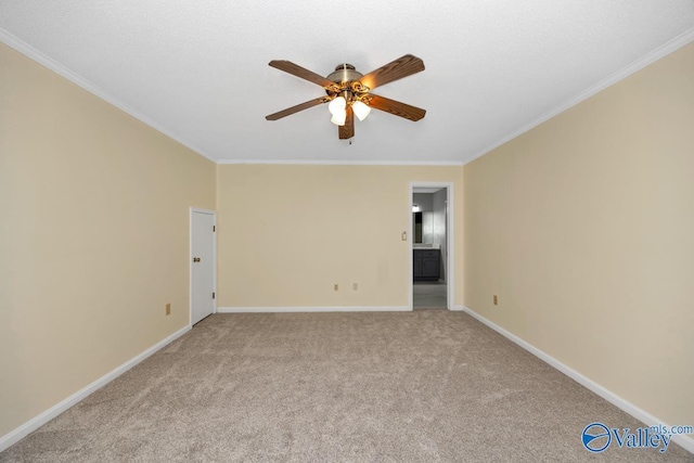 156 San Leonardo Way, Huntsville, AL 35811 - empty room featuring a ceiling fan, crown molding, baseboards, and light carpet