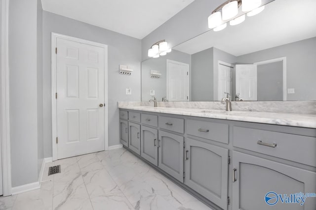 156 San Leonardo Way, Huntsville, AL 35811 - bathroom with double vanity, marble look tiles, and baseboards