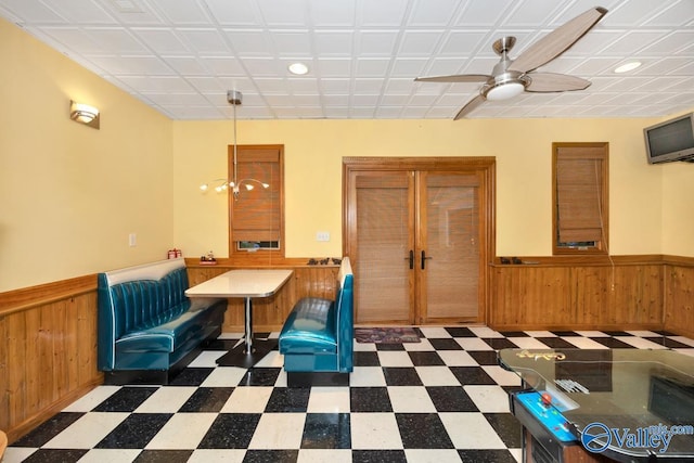 156 San Leonardo Way, Huntsville, AL 35811 - unfurnished dining area featuring a wainscoted wall, tile patterned floors, wood walls, ceiling fan, and recessed lighting