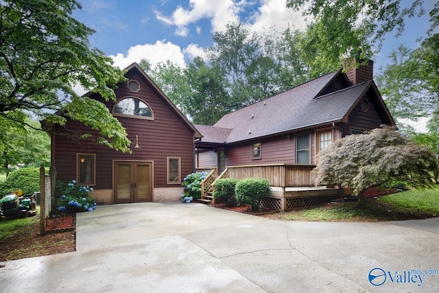 156 San Leonardo Way, Huntsville, AL 35811 - chalet / cabin with french doors, a chimney, a wooden deck, and concrete driveway