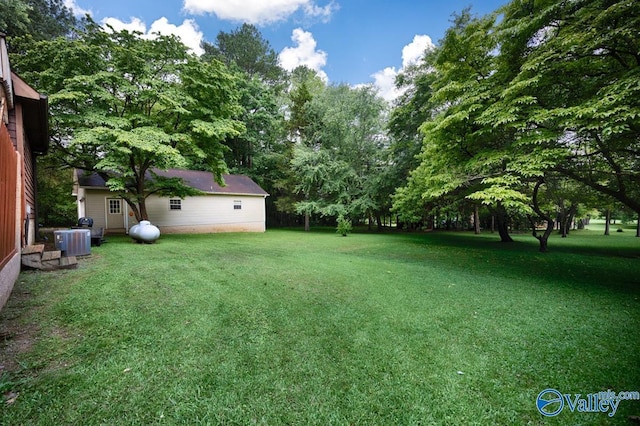 156 San Leonardo Way, Huntsville, AL 35811 - view of grassy yard with central air condition unit and view of scattered trees