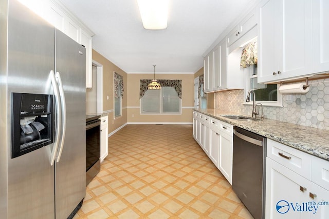 156 San Leonardo Way, Huntsville, AL 35811 - kitchen featuring appliances with stainless steel finishes, a sink, light flooring, white cabinets, and baseboards