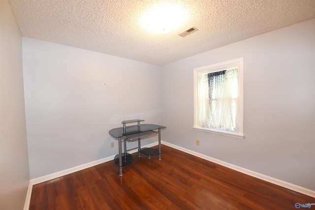 1208 SE Teenajo Dr SE, Huntsville, AL 35803 - unfurnished room with wood finished floors and a textured ceiling