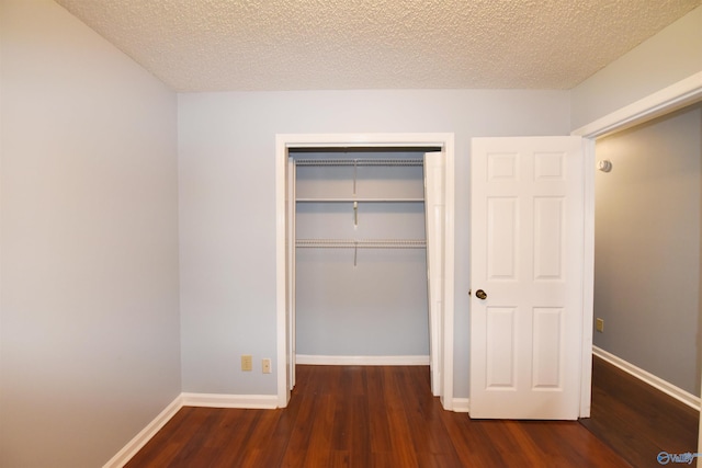 1208 SE Teenajo Dr SE, Huntsville, AL 35803 - unfurnished bedroom featuring wood finished floors, a closet, and a textured ceiling