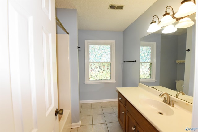 1208 SE Teenajo Dr SE, Huntsville, AL 35803 - full bathroom with vanity, tile patterned flooring, a textured ceiling, and shower / tub combination