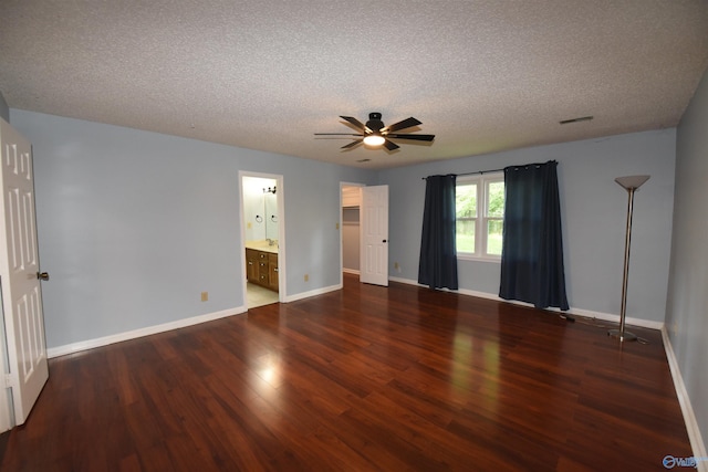 1208 SE Teenajo Dr SE, Huntsville, AL 35803 - unfurnished bedroom with wood finished floors, a textured ceiling, ceiling fan, and connected bathroom