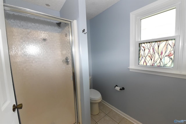 1208 SE Teenajo Dr SE, Huntsville, AL 35803 - full bathroom with tile patterned flooring, a stall shower, and a textured ceiling