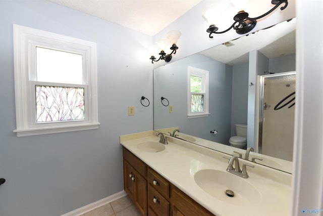 1208 SE Teenajo Dr SE, Huntsville, AL 35803 - full bathroom featuring double vanity, a shower stall, and tile patterned floors