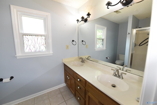 1208 SE Teenajo Dr SE, Huntsville, AL 35803 - full bathroom with double vanity, a shower stall, and tile patterned floors