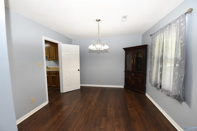 1208 SE Teenajo Dr SE, Huntsville, AL 35803 - unfurnished dining area featuring a chandelier and dark wood-style flooring