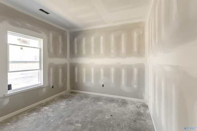 unfurnished room featuring baseboards