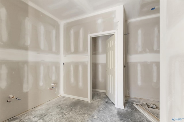 bathroom featuring unfinished concrete flooring