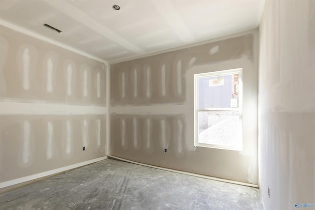 spare room with unfinished concrete floors