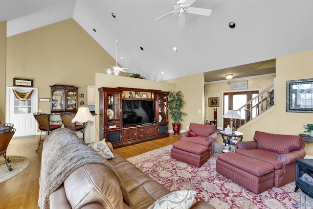 living room featuring light wood-type flooring, high vaulted ceiling, and ceiling fan