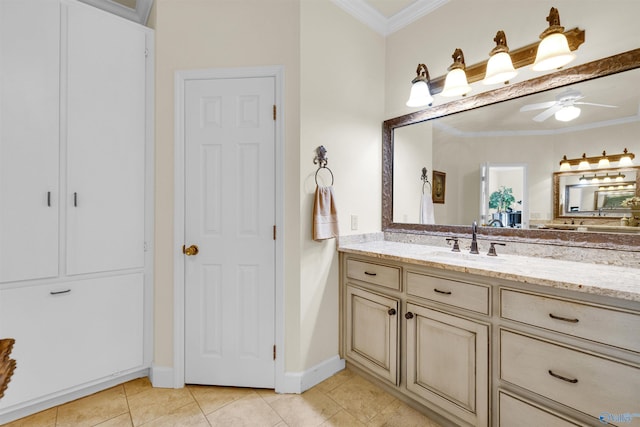 bathroom with vanity, ceiling fan, tile patterned flooring, and ornamental molding