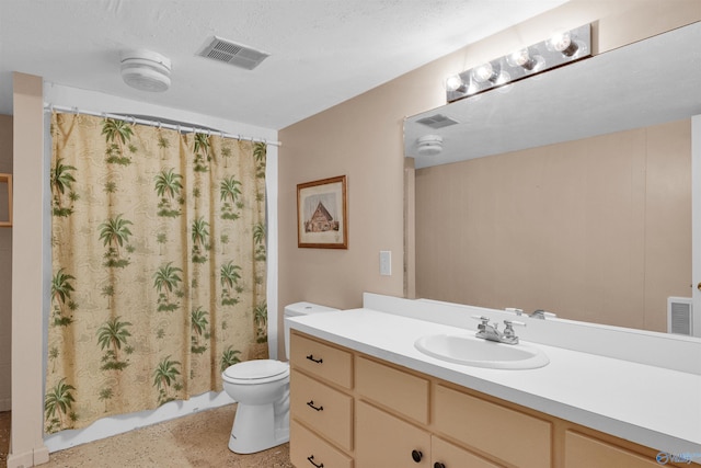 bathroom with toilet, a textured ceiling, and vanity