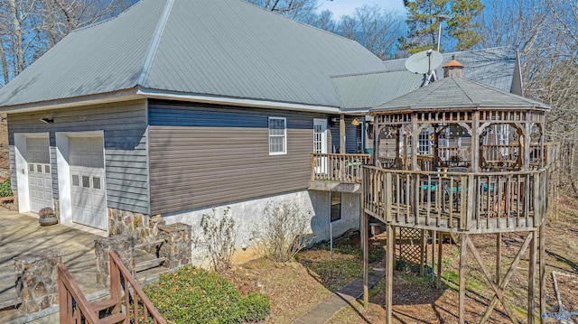 view of property exterior with a gazebo