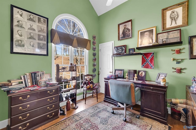 office area featuring light hardwood / wood-style floors and lofted ceiling