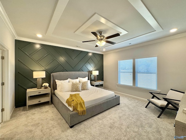 bedroom featuring carpet, crown molding, baseboards, ceiling fan, and a raised ceiling