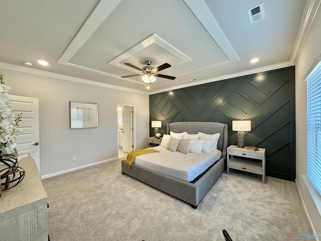 bedroom featuring ornamental molding, light carpet, baseboards, ceiling fan, and ensuite bath