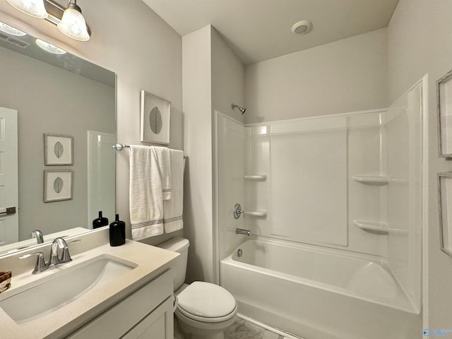 full bathroom with marble look tile flooring, toilet, vanity, and bathtub / shower combination