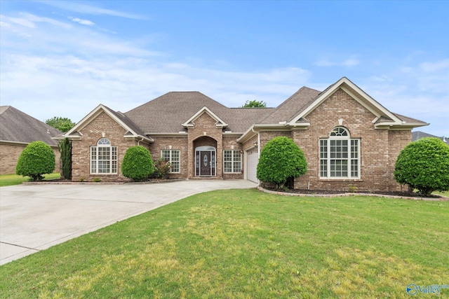 2201 Martinwood Ln SW, Decatur, AL 35603 - view of front of house featuring brick siding, concrete driveway, an attached garage, a front lawn, and roof with shingles