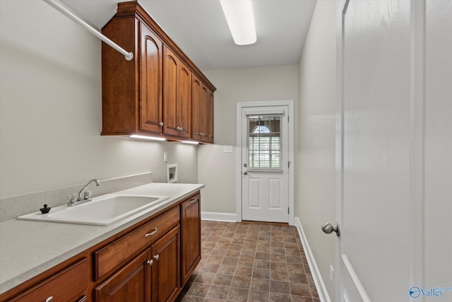 2201 Martinwood Ln SW, Decatur, AL 35603 - clothes washing area with cabinet space, washer hookup, baseboards, and stone finish flooring