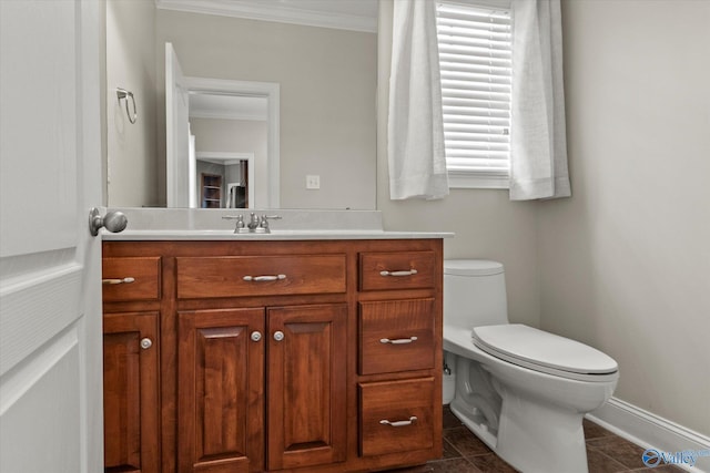 2201 Martinwood Ln SW, Decatur, AL 35603 - bathroom featuring crown molding, toilet, vanity, tile patterned flooring, and baseboards