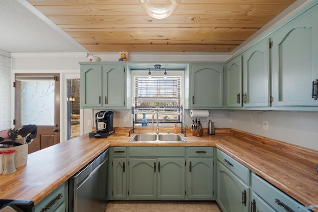 kitchen with stainless steel dishwasher, butcher block counters, a sink, and green cabinets