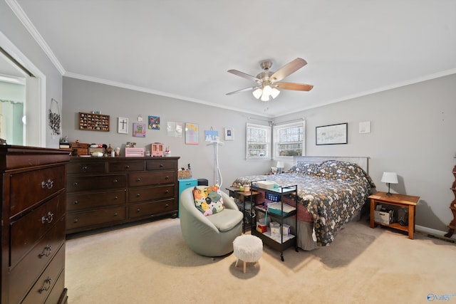 bedroom featuring ornamental molding, light colored carpet, and a ceiling fan