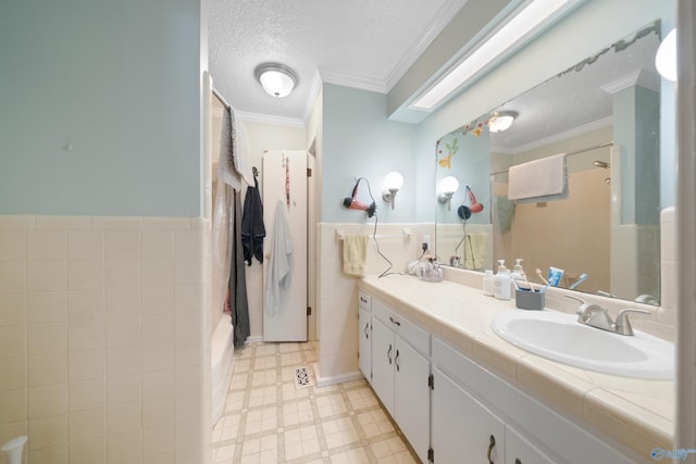 full bath featuring a textured ceiling, crown molding, walk in shower, and tile patterned floors