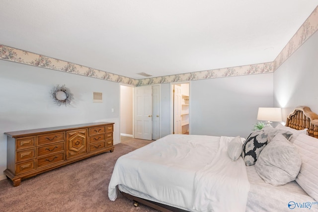 bedroom featuring carpet flooring and visible vents
