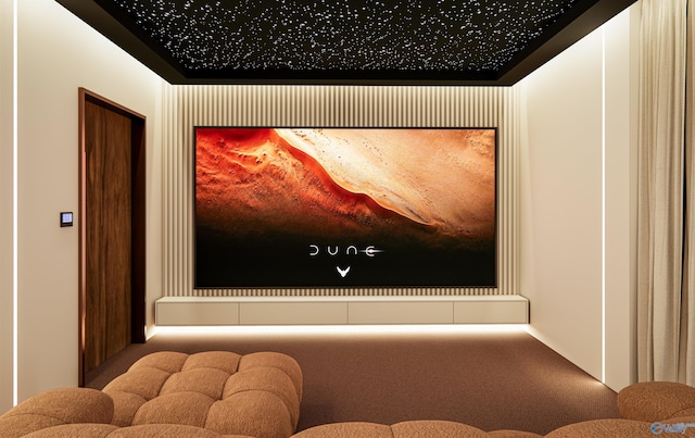 cinema room featuring carpet flooring