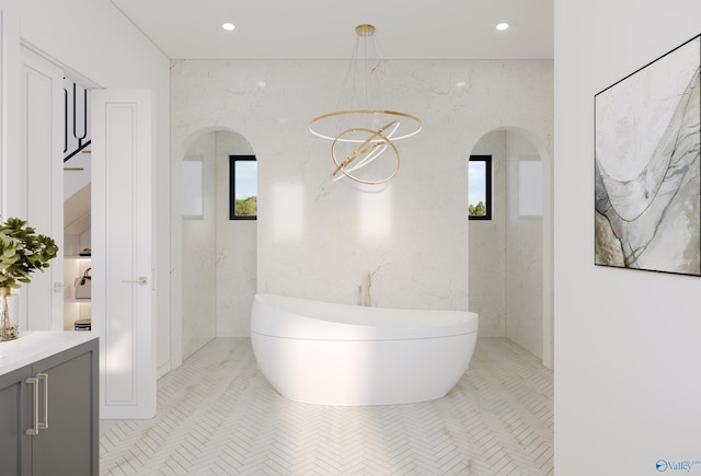 bathroom with vanity, tile patterned flooring, and a tub